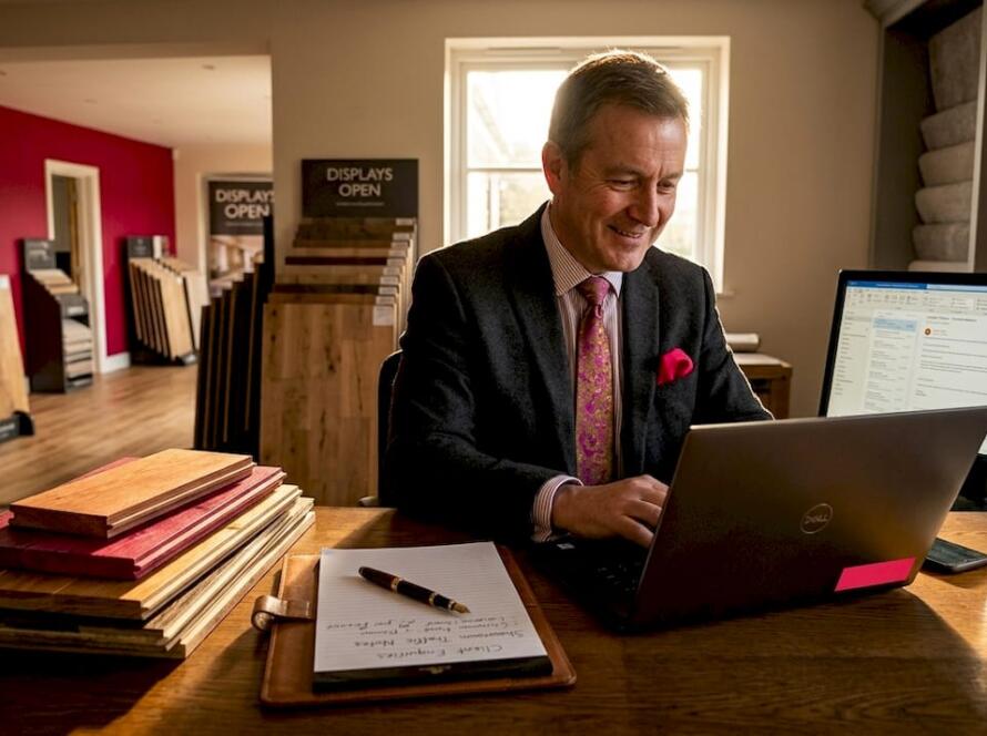 Manager reviewing customer enquiries at desk