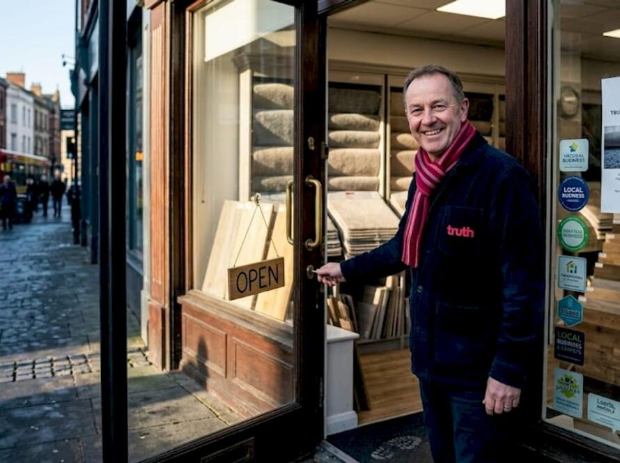 Flooring shop owner opening UK store in morning